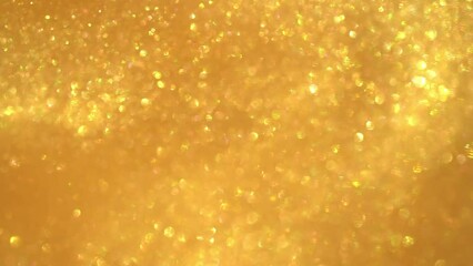 Wall Mural - Slow abstract movement of flying gold particles. Gold luxurious moving background. Chaotically moving gold glittery dust particles and bokeh move in waves and spirals on a gold background. 