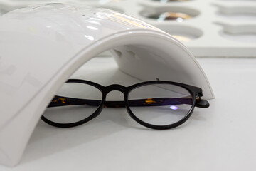 Canvas Print - UV testing machine for eyeglasses, auto-dimming lenses
