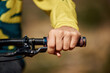 © Michael C/peopleimages.com - Hand, handle and bike with a man athlete or cyclist riding outdoor for fitness, exercise or cardio. Workout, health grip with a male bicycle rider holding on a handlebar while outdoor for endurance