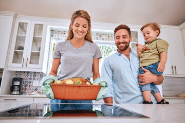 Cooking, parents and child happy with meal for dinner in the kitchen of their house. Turkey, thanksgiving and mother and father with kid and smile for family food, Christmas or lunch on the stove