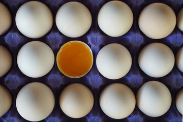 Wall Mural - Eggs standing side by side in the box. A box of broken eggs