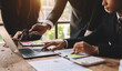 © Nuttapong punna - The business team analyzes revenue charts and graphs with laptop and tablet.Business analysis and strategic ideas...