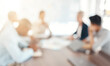 Innovation, blur and business people in a meeting planning a creative marketing strategy in a development project. Blurry, teamwork and employees talking, speaking and coworking for a startup company