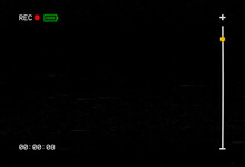 Intentional Distortion Datamosh: The Blank Screen Of A Vintage VHS VCR Recorder; Black Background, White Icons And Text, Recording With A Red Dot And A Full Green Battery.
