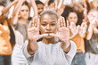 Protest, stop hands and black woman with people .fighting for peace, end to racial discrimination or freedom. Politics, justice or rally, activism or group demand social change or human rights.
