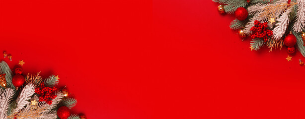 Wall Mural - Banner with Christmas decoration and pine tree on red background with copy space. New Year greeting card. Flat lay