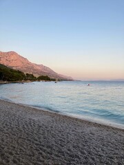 Poster - Beautiful seascape at soft pink sunset, in a vertical shot