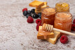 © Avocado_studio - Toasted bread toast with jam. A jar of raspberry jam. Delicious toast with sweet jam served for breakfast on the table. Delicious toasts on a textured background. Space for text. Place for copying.