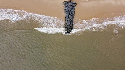 Canvas Print - Aerial view looking straight down onto waves crashing onto the beach. Taken in Southwold England. 