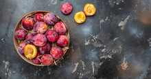 Fresh Plum. Red Whole Plums On A Dark Background. Place For Text, Top View