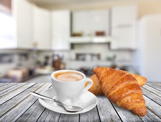 Sticker - Tasty fresh croissant and cup of coffee on table