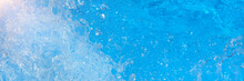 Surface Of Blue Swimming Pool Water With Light Reflection, Splashes And Waves. Texture Of Transparent Blue Water With Waves In Swimming Pool. Trendy Abstract Nature Background. Long Banner.