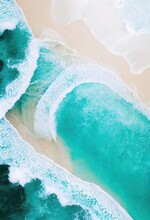 Waves Rolling Onto A White Beach Aerial Top Down View