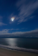 Wall Mural - clouds streaking past the moonrise at myrtle beach