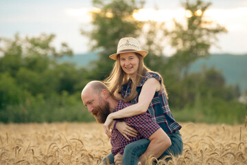 Wall Mural - Loving couple in a wheat field.