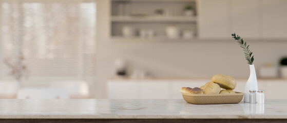 Elegance white marble kitchen tabletop with copy space over blurred background of modern kitchen