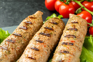 Juicy soy meat sausages close-up. Vegetarian lula kebab. Selective focus.