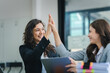 © Daenin - young women working together hands together teamwork Smiling happy and excited at her work.