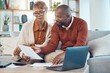 © Wesley J/peopleimages.com - Documents, laptop and couple working on financial budget, savings strategy or payment of bank account bills. Finance review, black woman and man with calculator for home accounting, taxes or mortgage