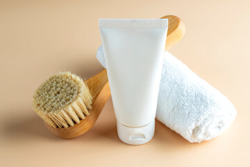 Poster - organic cosmetics, body cream, wooden brush, and towel on a beige background. The concept of spa and wellness.