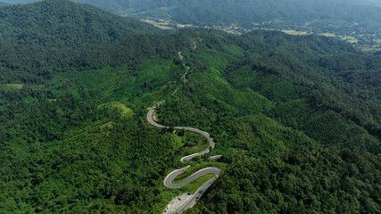 Wall Mural - aerial view ROAD No.1081 of winding mountain road between Pua Ddistric, Nan Province, Thailand is highlignt that tourist like to take pictures