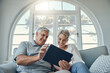 © Delcio F/peopleimages.com - Senior couple tablet, relax smile and living room sofa for social media, email or internet video. Woman man retirement, home happiness with mobile technology and comic social network on web app