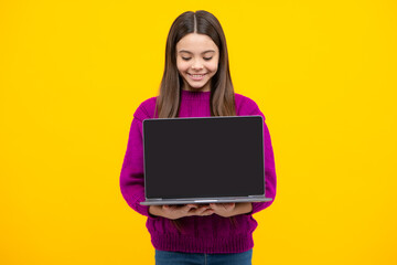 Wall Mural - Young student school girl, studying with laptop computer. Screen of laptop computer with copyspace mockup. E-learning concept.