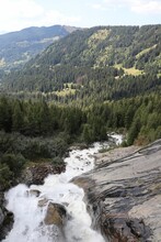 Vertical Shot Of A Flowing Splashing Stream In The Mont Blanc Mountains