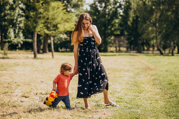 Wall Mural - Mother with her little son together in park