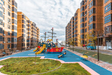 A Bright Playground Inside A Residential Complex Of High-rise Apartment Buildings