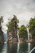 Vertical shot of scenic sandstone rocks in Cheow Lan lake in Khao Sok National Park, Thailand