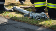The Fire Brigade's Standpipe For A Hydrant Lies On The Ground