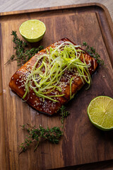 Poster - salmon steak in grilled sauce on a wooden board