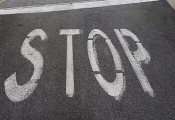 Wall Mural - stop sign on tarmac