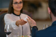 © Friends Stock - Businessman giving his visit card to woman while having dinner in luxury hotel restaurant