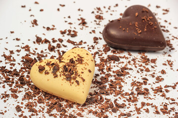 View of two chocolate hearts on a white background, close-up. Valentine's Day concept