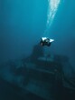 Scuba diver exploring a wrecked ship in the area of Gozo island, Malta