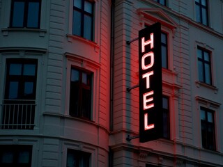 Wall Mural - Neon sign of a hotel on the wall