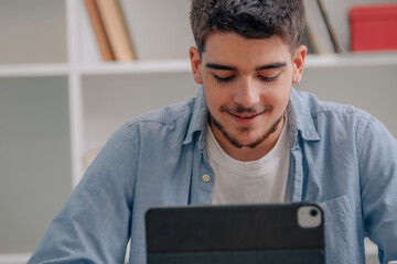 Poster - student with laptop or tablet at home