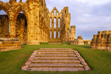 Sunset View Of Whitby Abbey Overlooking The North Sea On The East Cliff Above Whitby In North Yorkshire, England