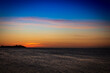Blue sky with yellowish sunset on the beach