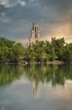 Scenic vertical view of a tranquil lake with The National Carillon in the background