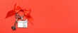 © Pixel-Shot - Key from new house with ribbon bow on red background with space for text. Concept of real estate