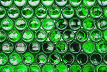 Glass Bottles Green. Green Glass Bottles Of Beer. Wall Formed By Green Bottles. Green Bottles Background. Empty Glass Bottle With Lighting
