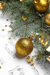 Poster - Christmas ball with fir branches and serpentine on note sheets, closeup