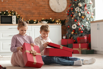 Sticker - Little children opening Christmas presents in kitchen