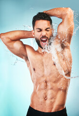 Poster - Body, water and shower with a muscle man in studio on a splash blue background for wellness or skincare. Bathroom, beauty and wet with a handsome young male washing his skin for hygiene cleanliness