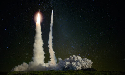 Wall Mural - two missiles launch at night. escalation of the political situation. elements of this image furnishe