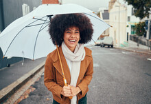 Rain, Umbrella And City With A Walking Black Woman In The Street During A Cold Or Wet Winter Day. Water, Insurance And Cover With A Young Afro Female Outdoor For A Walk In An Urban Town Road