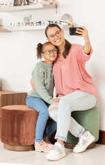 Canvas Print - Glasses, retail and selfie with mother and child in vision and optometry store for eyewear. Shopping, photo and parent taking picture in eyewear shop for eye care, eye health ophthalmology